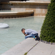A man cools off in the fountain of Trocadero, in Paris, France, on June 25.